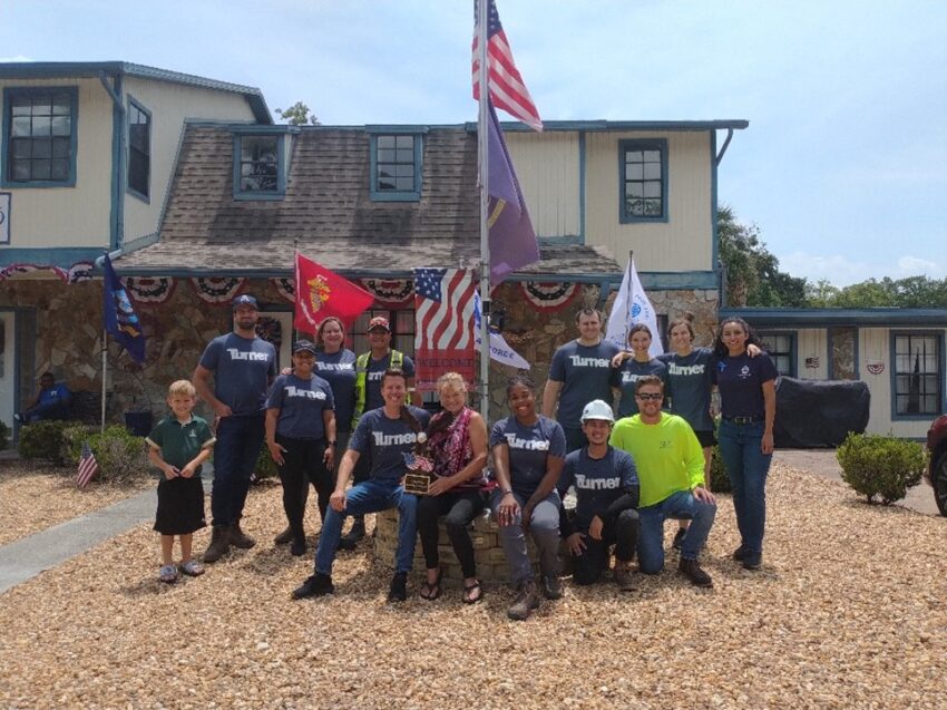 Turner Construction employees in front of Liberty Manor Veterans home