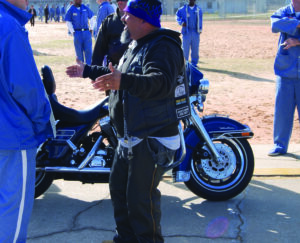Ministry on motorcycles visiting prison and sharing Gods word.